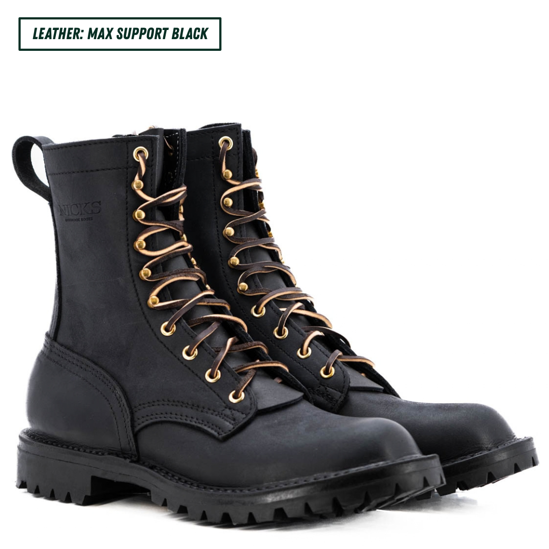 A pair of black leather lace-up combat boots with gold-tone eyelets and a rugged sole, shown on a white background with a text label in the top left corner.