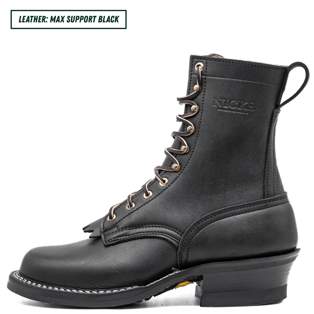 A black leather lace-up boot shown in profile on a white background, with a text label in the top-left corner that reads 'LEATHER: MAX SUPPORT BLACK'. The boot has a low block heel, white contrast stitching, and a pull tab at the heel.