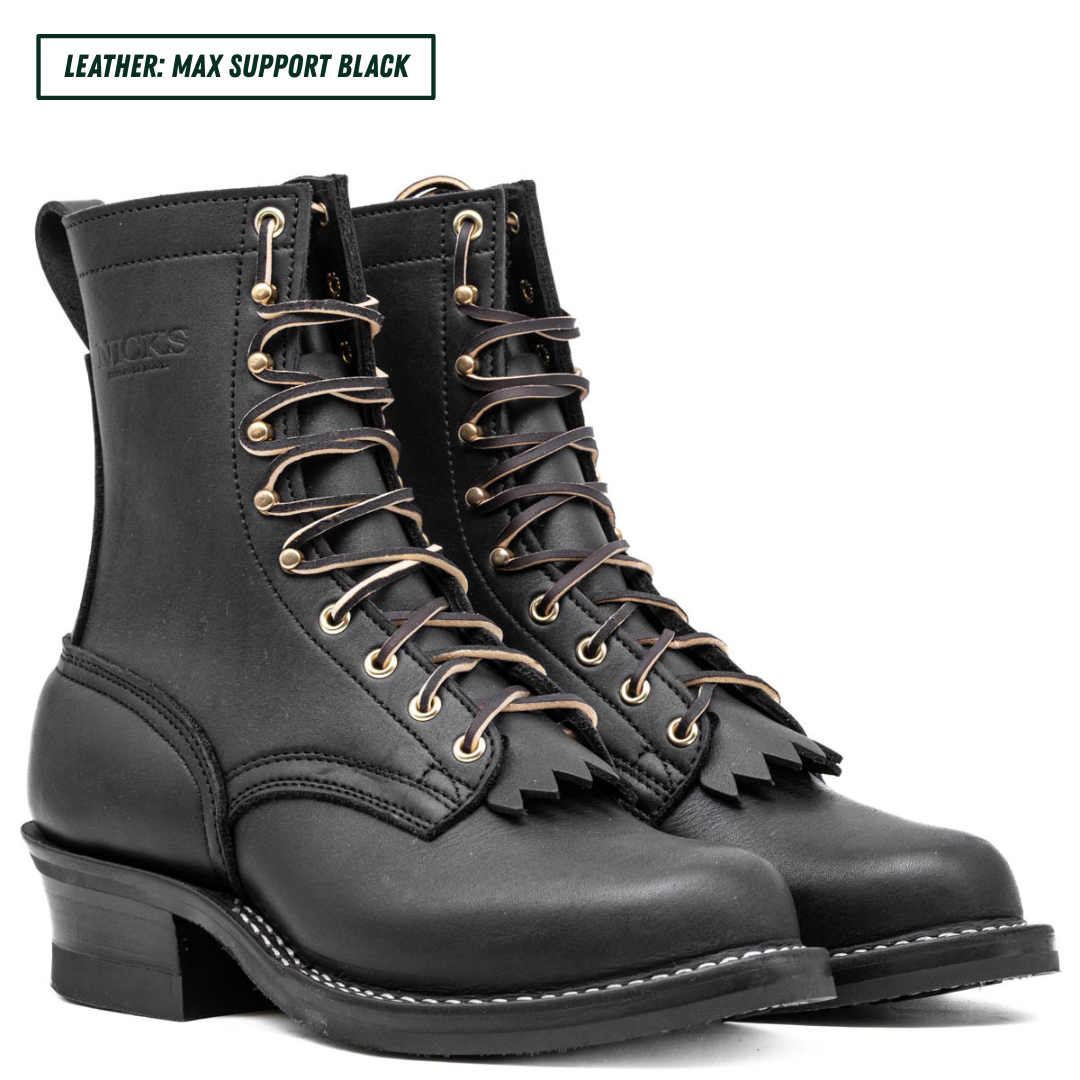 A pair of black leather lace-up boots with gold-tone eyelets and a fringe detail on the front, shown against a white background with a text label in the top left corner.