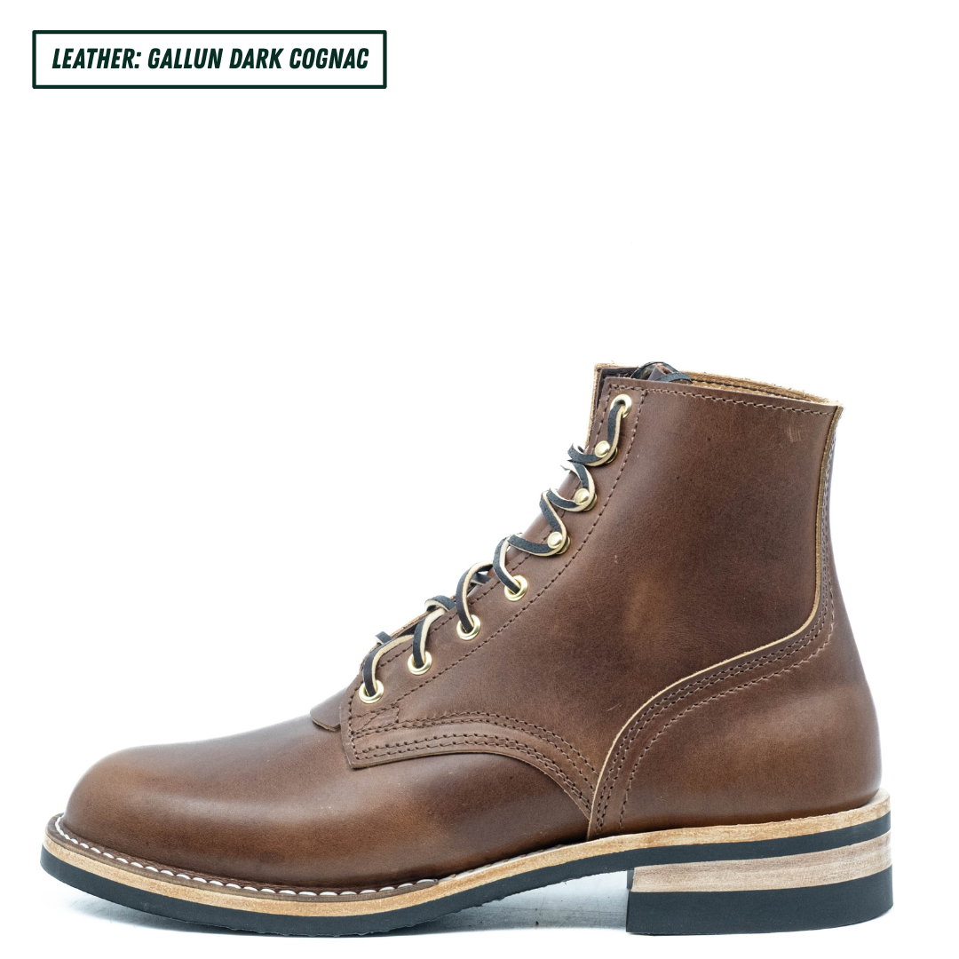 A single brown leather lace-up ankle boot shown in side profile on a white background, with a text label in the top-left corner reading 'LEATHER: GALLUN DARK COGNAC'.