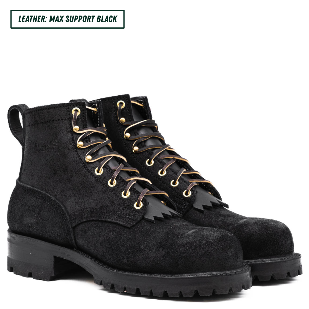 All black leather boots with lug soles. Boots sitting together facing forward right. Top left reads "LEATHER: MAX SUPPORT BLACK."