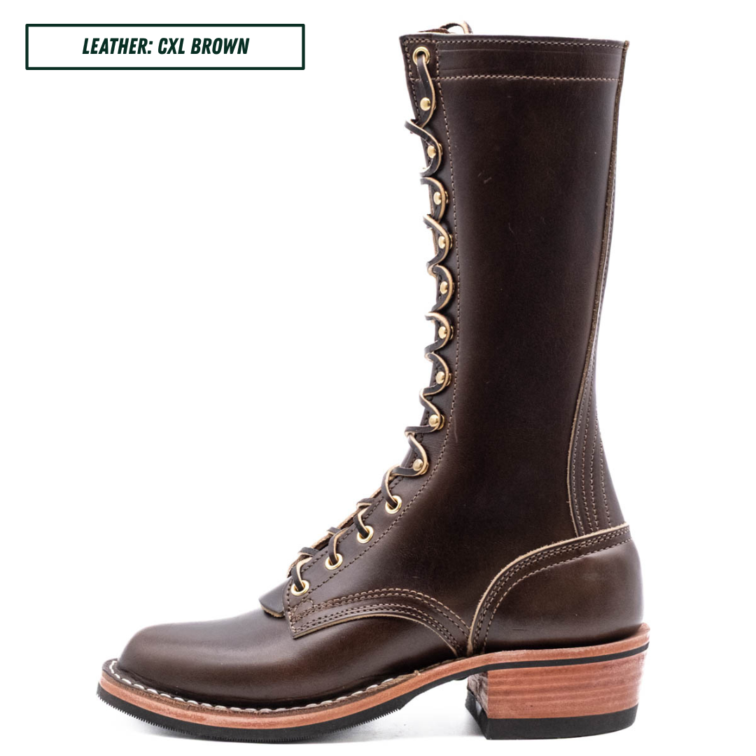 A tall brown leather lace-up boot with gold-tone eyelets and contrast stitching, shown in profile against a white background. A text label in the top-left corner reads 'LEATHER: CXL BROWN'.