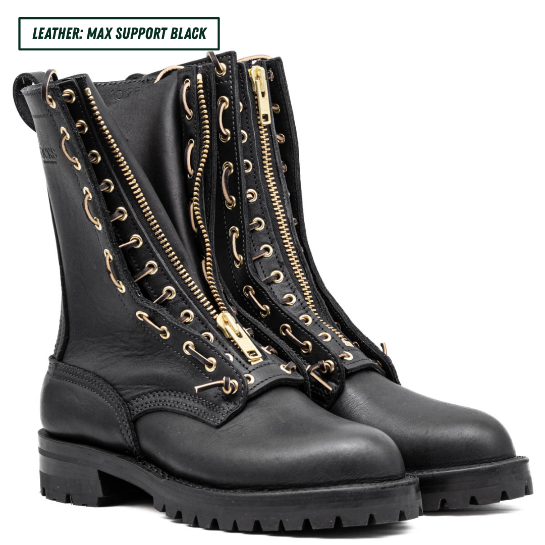 Black leather boots with gold zippers on a white background