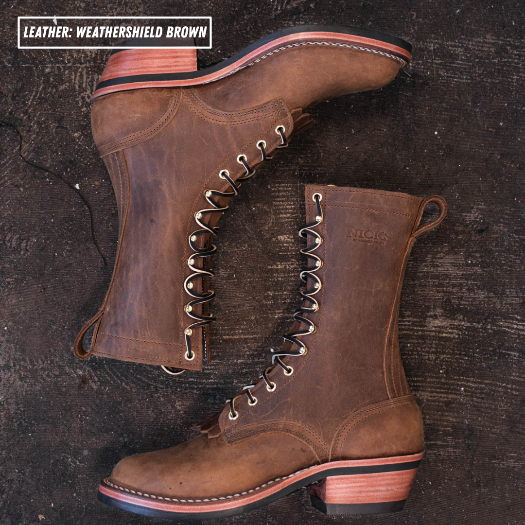 Brown packer boots laying on textured concrete. Top left reads 'LEATHER: WEATHERSHIELD BROWN.'