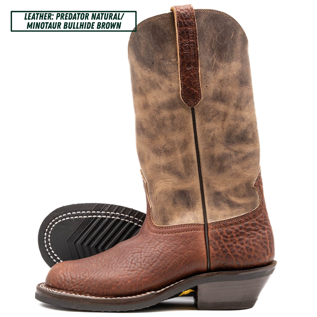 A pair of distressed leather cowboy boots in brown and tan, with one boot standing upright and the other lying on its side to show the sole. A text label in the top left corner reads 'LEATHER: PREDATOR NATURAL/ MINOTAUR BULLHIDE BROWN'.