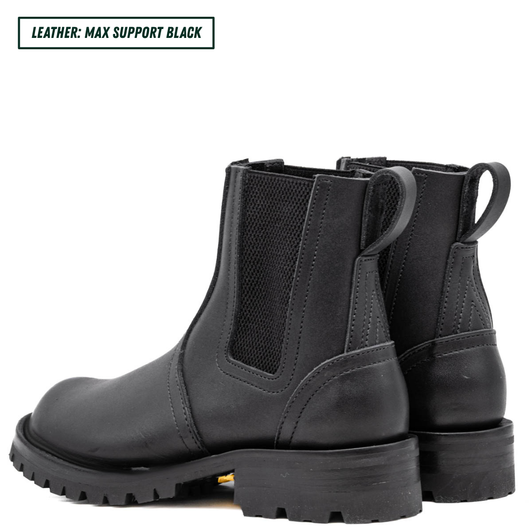 Blackout Chelsea boots showing back profile and heel stack. Top left reads 'LEATHER: MAX SUPPORT BLACK'.