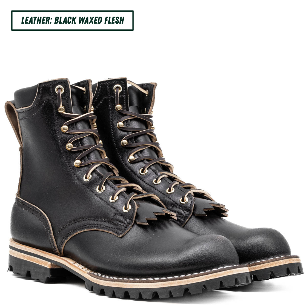 A pair of black leather lace-up boots with frayed detailing around the eyelets and collar, shown on a white background with a text label in the top left corner.
