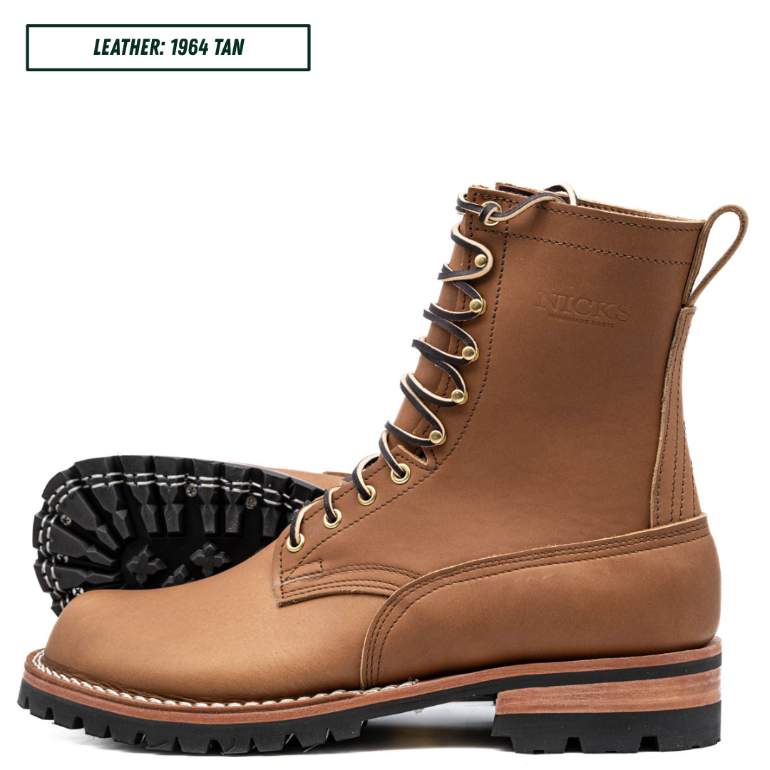 A tan leather lace-up work boot shown in profile with a black treaded outsole visible behind it. A small label at the top reads 'LEATHER: 1964 TAN'.