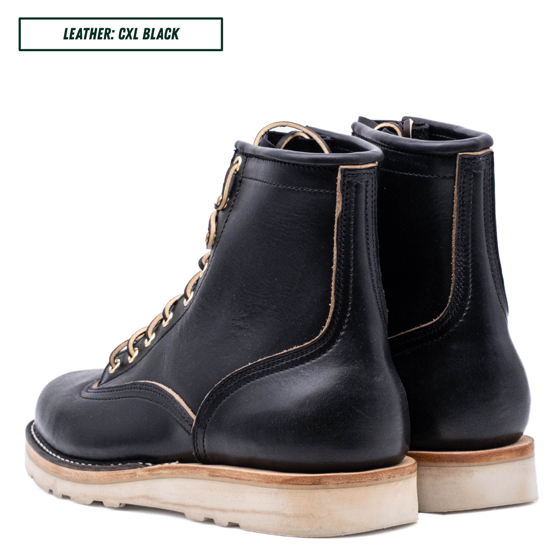 A pair of black leather lace-up ankle boots shown from the side and back on a white background, with a text label in the top left reading 'LEATHER: CXL BLACK'.