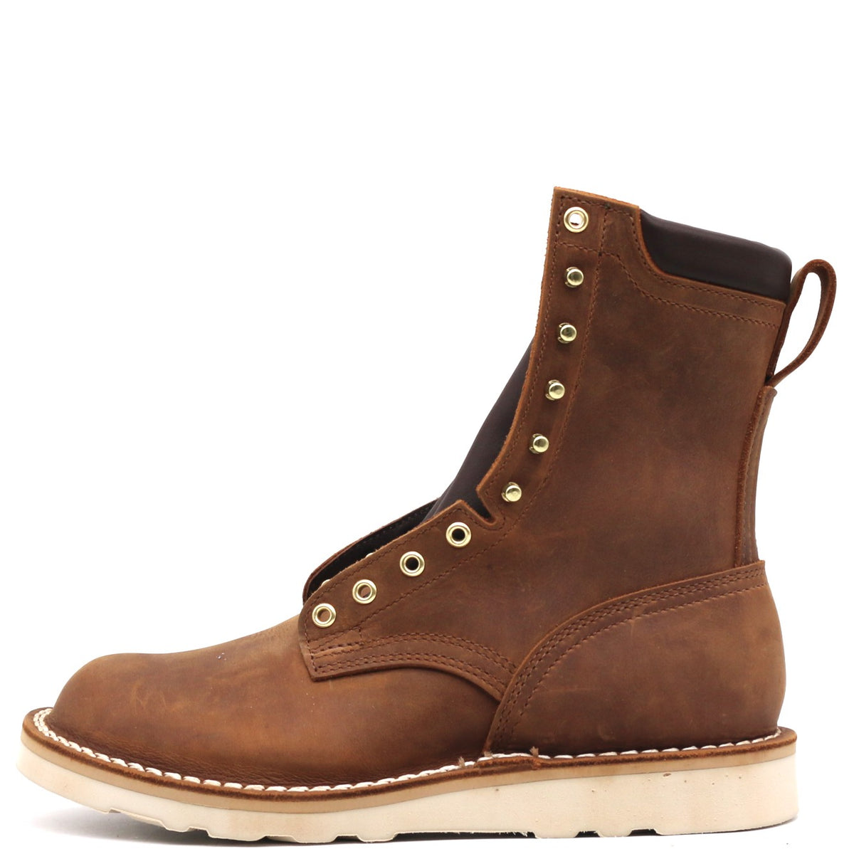 A brown leather lace-up ankle boot with brass eyelets, a pull tab, and a thick off-white sole, shown from a side profile on a white background.