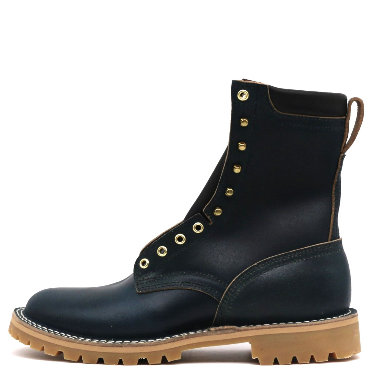 A single dark navy leather lace-up ankle boot with gold-tone metal eyelets and studs, a tan sole, and a pull tab on the heel, shown against a plain white background.