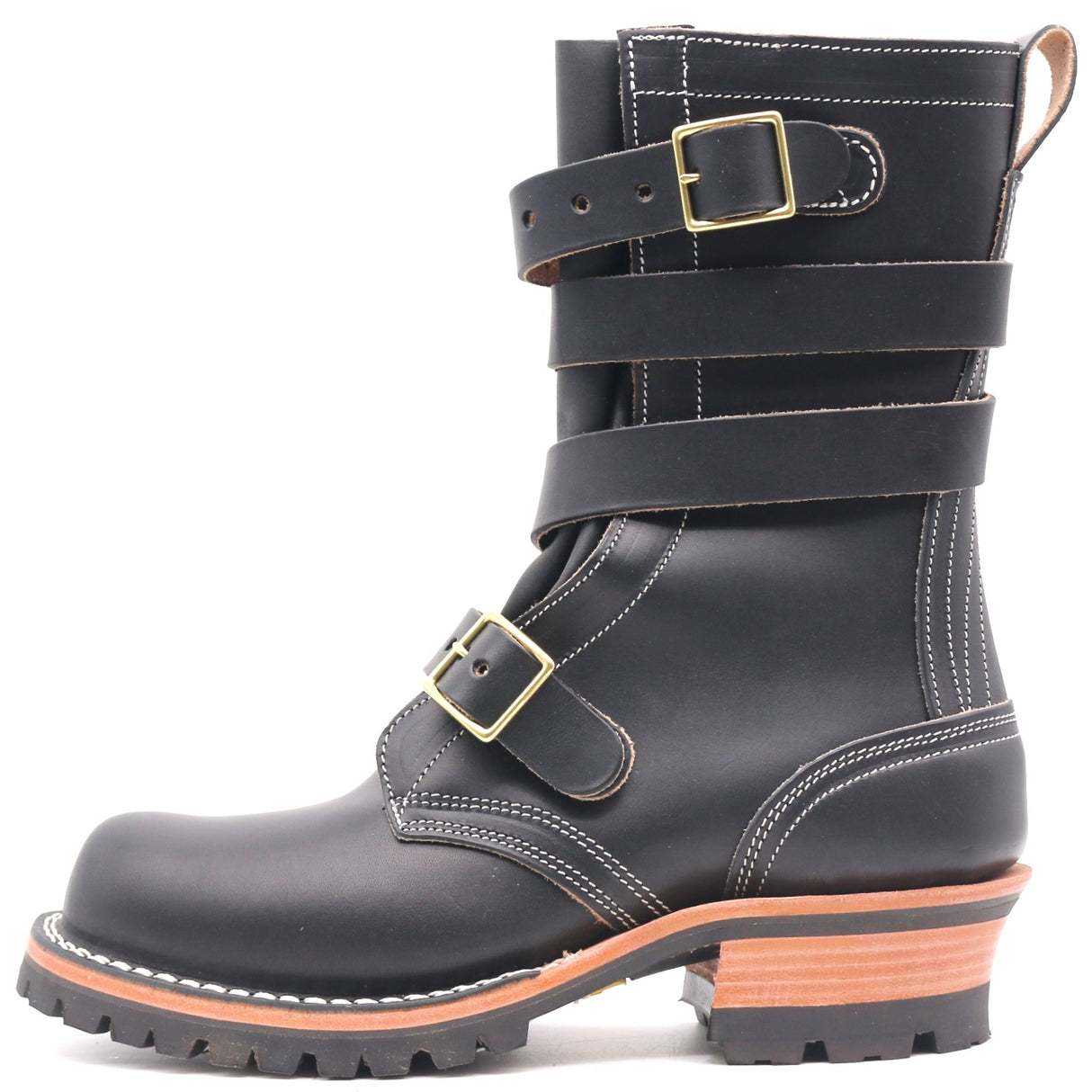 A black leather mid-calf boot with double buckle straps, contrast white stitching, and a stacked lug sole with a tan and black heel, shown against a plain white background.