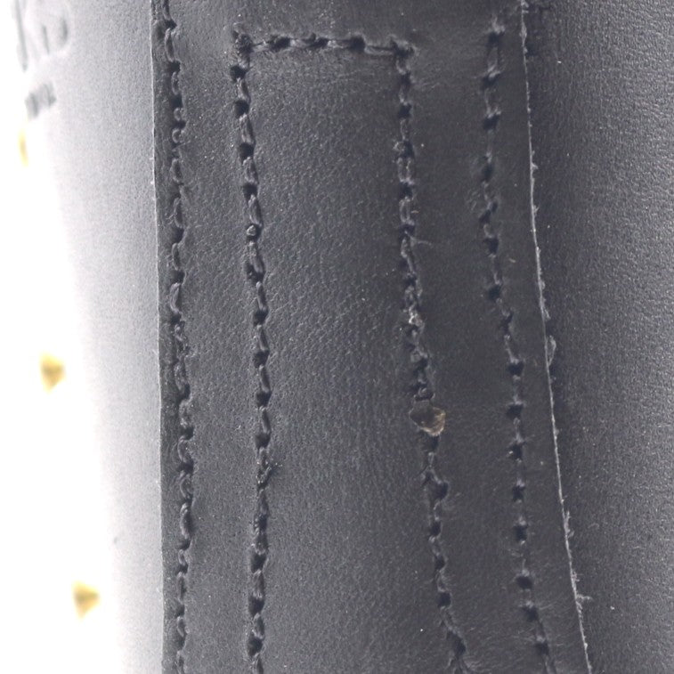 Close up of a boot backstay stitches. Visible inadequacies in the sewing.