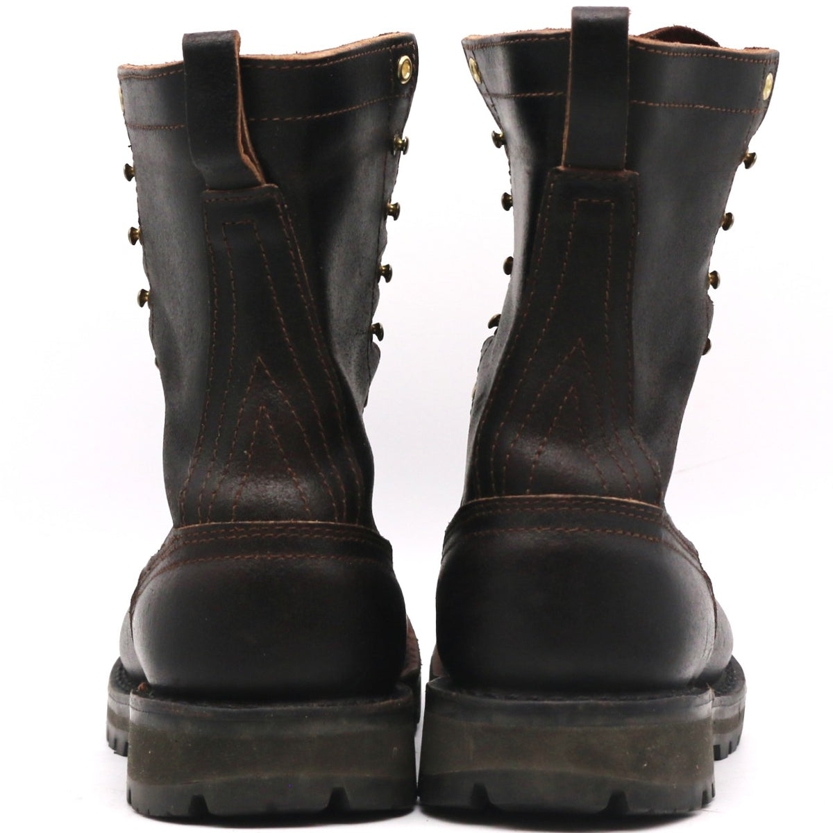 Pair of brown leather boots shown from behind. Heel counters and two-piece backstays are visible in front of a white background.