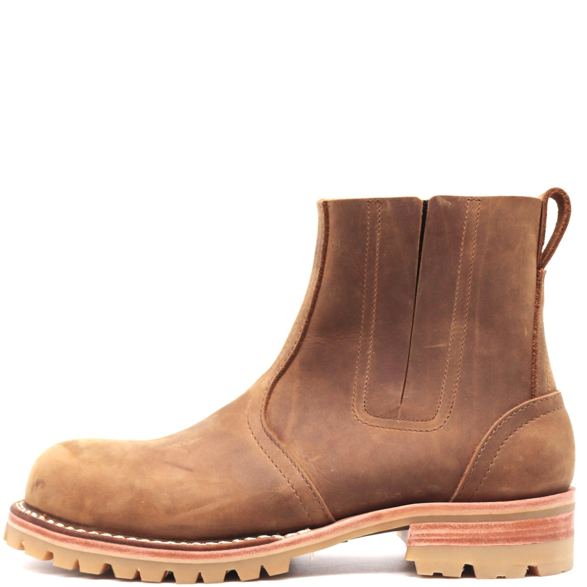 A single brown leather Chelsea boot with a pull tab, elastic side gore, and a chunky lug sole, shown in profile against a white background.