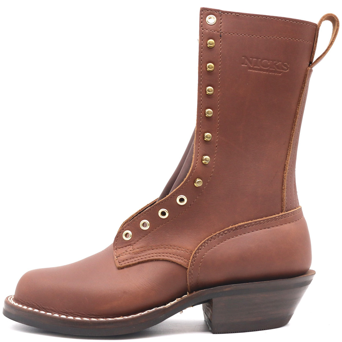 A brown leather ankle boot with a low block heel, decorative brass eyelets, and a pull tab, shown from a side profile on a white background.