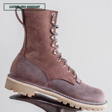 A single lace-up ankle boot in dark brown leather with a chunky beige lug sole, shown on a stand against a light gray background. A text label in the top left reads 'LEATHER - 1964 MAHOGANY'.