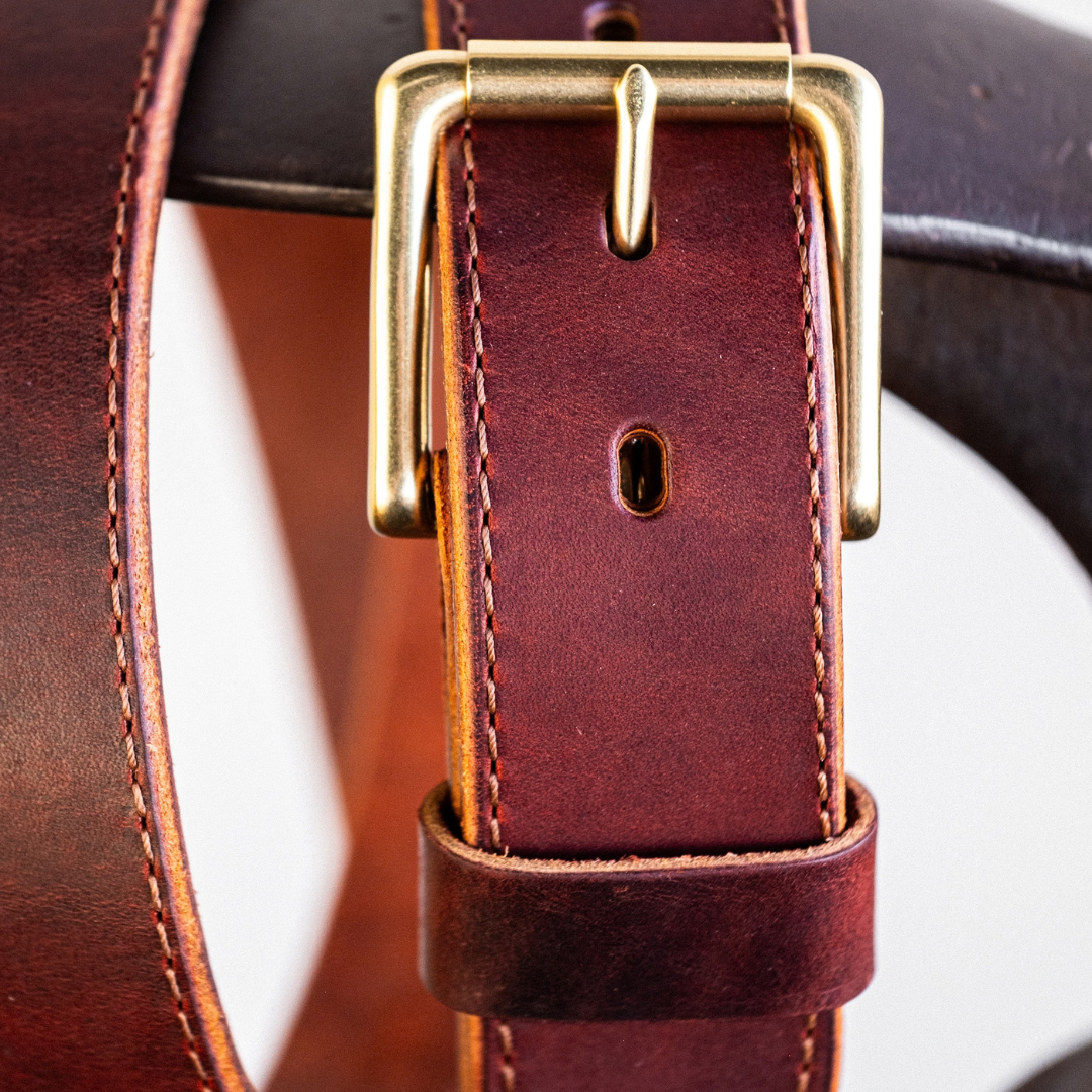 Zoomed in detail shot of buckle on Cypress Raisin Cherry Heritage belt