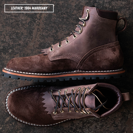 A pair of dark brown leather lace-up boots shown from top and side views on a dark textured background, with text in the upper left reading 'LEATHER: 1964 MAHOGANY'.