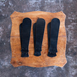Black CXL Kiltie variety mix on a wooden table.