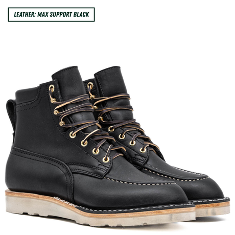 A pair of black leather lace-up boots with gold-toned metal eyelets and brown laces, shown on a white background with a text label in the top left corner that reads 'LEATHER: MAX SUPPORT BLACK'.