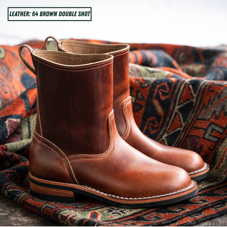 Brown leather pull on boots sitting together on patterned carpet. Text in the top left reads 'LEATHER: 64 BROWN DOUBLE SHOT'.
