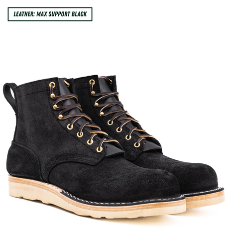 Short black boots sitting together facing forward right. Top left reads "LEATHER: MAX SUPPORT BLACK."