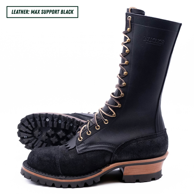 A tall black leather lace-up boot with a rugged sole, shown from the side with another boot placed behind it to display the tread. The text 'LEATHER: MAX SUPPORT BLACK' appears in the top-left corner.