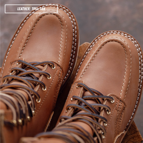 HD moc toe work boots, detail shot of moc toe stitching. Label on top left of picture that reads "LEATHER: 1964 TAN."