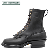 A black leather lace-up boot shown in profile on a white background, with a text label in the top-left corner that reads 'LEATHER: MAX SUPPORT BLACK'. The boot has a low block heel, white contrast stitching, and a pull tab at the heel.