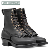 A pair of black leather lace-up boots with gold-tone eyelets and a fringe detail on the front, shown against a white background with a text label in the top left corner.