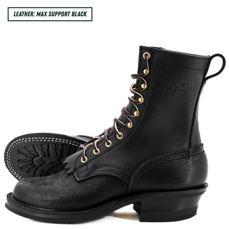 A pair of black leather lace-up boots with gold-tone eyelets and a low stacked heel, shown on a white background. One boot is in profile, and the other is turned to show the outsole.