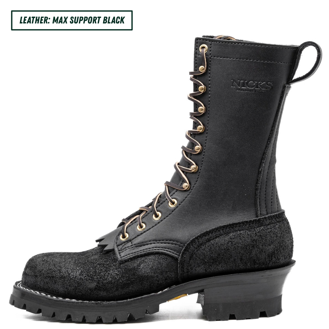 A black leather lace-up work boot with gold-tone eyelets and a thick lug sole, shown in profile on a white background. A text label in the top-left corner reads 'LEATHER: MAX SUPPORT BLACK'.