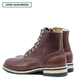 A pair of dark brown leather lace-up boots with gold-tone eyelets and laces, shown from a side profile view on a white background. A text label in the top left corner reads 'LEATHER: GALLUN BORDEAUX'.
