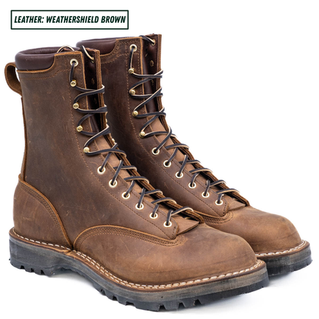 Weathershield brown lace to toe leather boots with padded collar. Boots sitting together facing right side. Label on top left stating "Leather: Weathershield Brown."