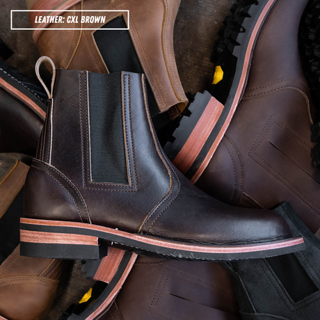 A dark brown leather Chelsea boot with elastic side panels and a stacked sole, shown among other brown boots. A text overlay in the top left reads 'LEATHER: CXL BROWN'.
