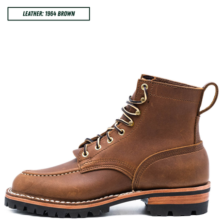 A single brown leather lace-up boot shown in side profile on a white background, with a small text label in the top-left corner reading 'LEATHER: 1964 BROWN'. The boot has tan metal eyelets, white contrast stitching, a thick black lug sole, and a layered tan and black midsole.