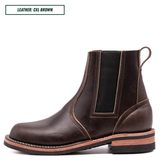 A dark brown leather Chelsea boot with a pull loop, elastic side gore, and stacked sole, shown in profile on a white background with a text label in the top-left corner.