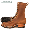 Moc Toe Lug boots, one sitting side profile and the other laying down showing the outsole. Top left reads 'LEATHER: 1964 BROWN.'