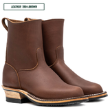 A pair of brown leather mid-calf boots with stacked wood-look heels, shown on a white background with a text label in the top-left corner reading 'LEATHER: 1964 BROWN'.