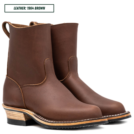 A pair of brown leather mid-calf boots with stacked wood-look heels, shown on a white background with a text label in the top-left corner reading 'LEATHER: 1964 BROWN'.