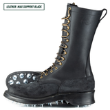 A black leather lace-up work boot with metal eyelets, a pull tab, and a spiked outsole, shown on a white background. A text label in the top-left corner reads 'LEATHER: MAX SUPPORT BLACK'.