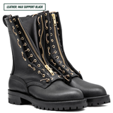 Black leather boots with gold zippers on a white background