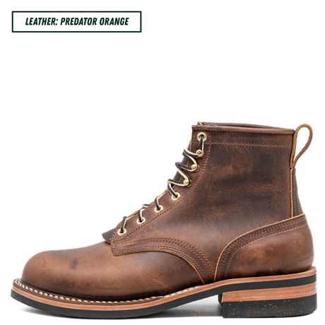 A single brown leather lace-up ankle boot shown in side profile on a white background, with a small text label in the top-left corner reading 'LEATHER: PREDATOR ORANGE'. The boot has brass eyelets, a pull tab, and a stacked sole with a black outsole.