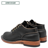 A pair of black leather lace-up shoes with light tan contrast stitching and stacked brown wooden heels, shown on a white background with a text label in the top left reading 'LEATHER: CXL BLACK'.
