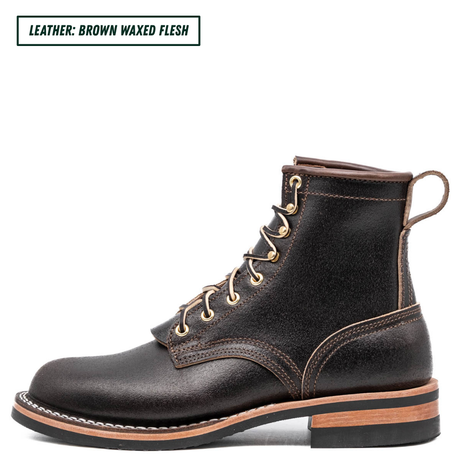 A dark brown leather lace-up boot with gold-toned metal eyelets, contrast stitching, and a pull tab, shown in profile on a white background with a text label in the top-left corner.