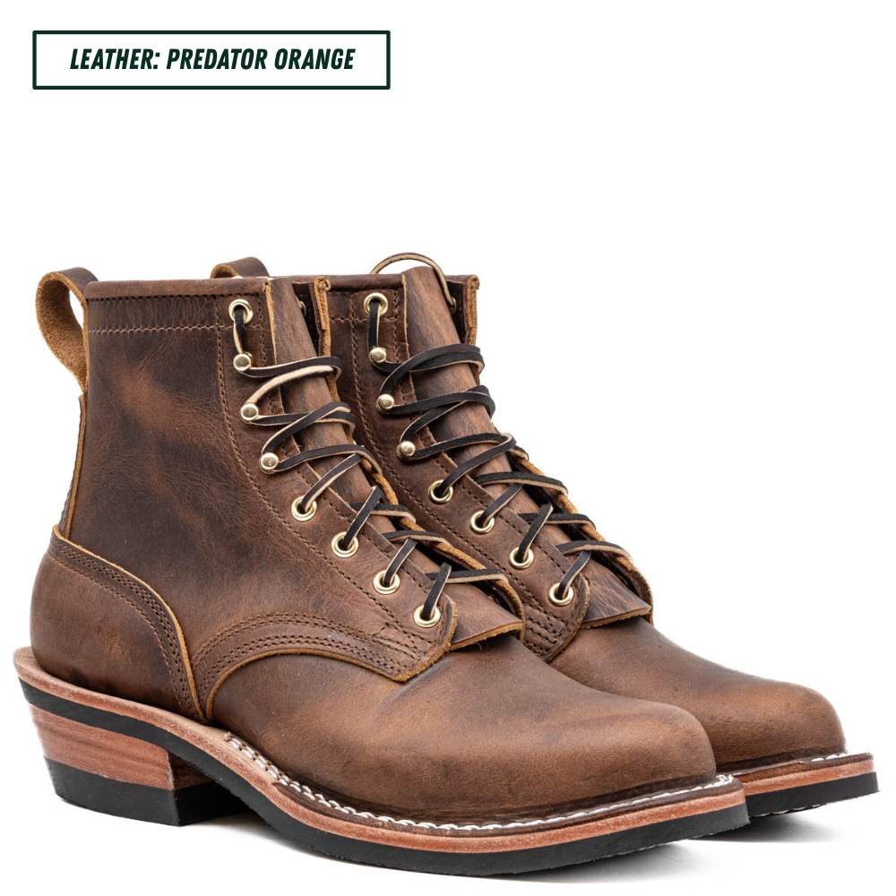 A pair of distressed leather lace-up ankle boots in a rich brown shade, shown against a plain white background with a text label at the top reading 'LEATHER: PREDATOR ORANGE'.