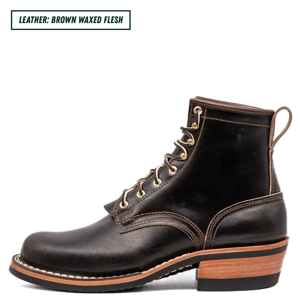 A single dark brown leather lace-up boot shown in side profile on a white background, with a small text label in the top-left corner reading 'LEATHER: BROWN WAXED FLESH'. The boot has tan contrast stitching, brass eyelets, a pull loop, and a stacked wood-look heel.