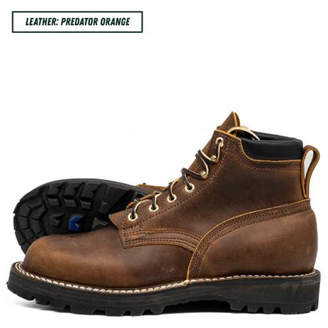 A pair of rugged lace-up ankle boots in distressed brown leather, with one boot standing upright and the other lying flat to show the treaded outsole. A text label in the top-left corner reads 'LEATHER: PREDATOR ORANGE'.