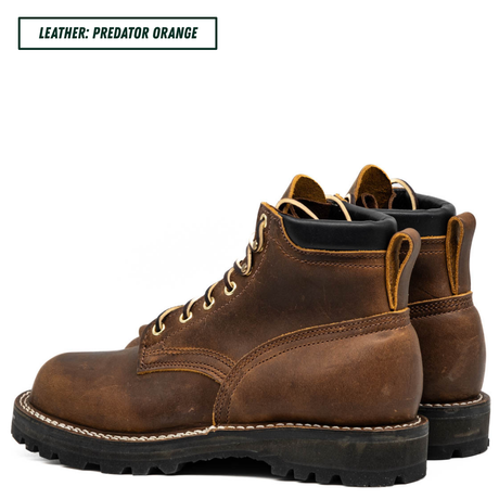 A pair of rugged brown leather lace-up boots with black soles and black collar lining, shown on a white background with a text label in the top-left corner that reads 'LEATHER: PREDATOR ORANGE'.